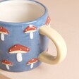 Close Up of Blue Embossed Toadstool Ceramic Mug Handle