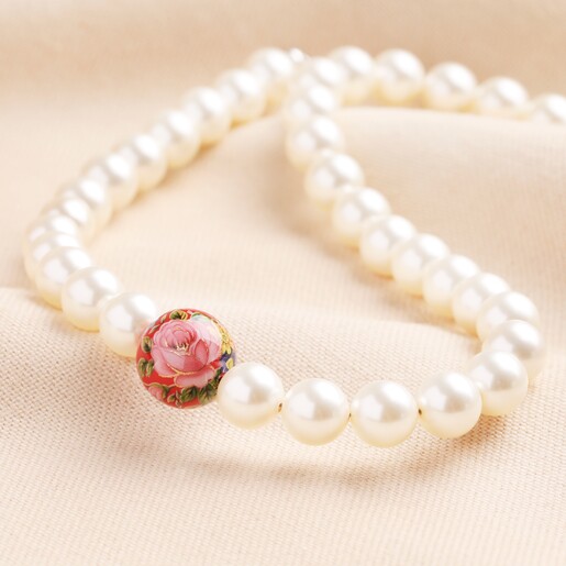 Small 20th Anniversary Pearl Necklace With Red Tensha Bead on Neutral Fabric