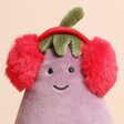 Close Up of Jellycat Vivacious Red Toastie Aubergine Soft Toy on a white background with red earmuffs and a green top