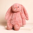 Jellycat Medium Bashful Sorrel Bunny Soft Toy against a beige background