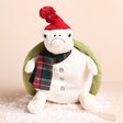 Jellycat Snowman Timmy Turtle Soft Toy with a red beanie hat and green shell and a grumpy face