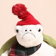 Jellycat Snowman Timmy Turtle Soft Toy with a red beanie hat and green shell on a neutral background