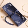 Navy Celestial Velvet Jewellery Roll  against beige surface