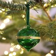 A Ribbed Green Glass Secret Opening Bauble with a Gold Hinge