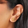 Close Up of Sterling Silver Knot Stud Earrings in Gold 