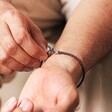 Close Up of Personalised Men's Braided Vegan Leather T-Bar Bracelet in Brown on Model