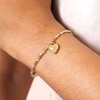 Close Up of Neutral Cord Heart Charm Bracelet in Gold