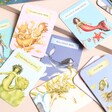 Match the Mermaids: A Memory Cards Game with the cards out of the box on a neutral background