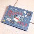 A book featuring five letters from santa to read