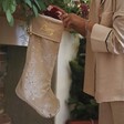 Lifestyle Shot of Personalised Large Starry Cream Velvet Christmas Stocking 