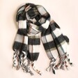 Charcoal Tartan Winter Scarf on a Beige Background