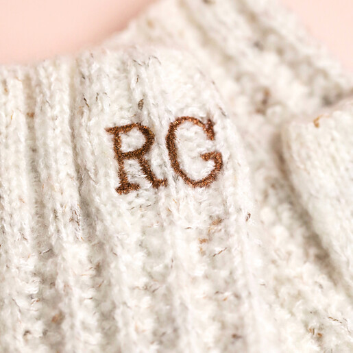 Close Up Close up of personalisation on Personalised Embroidered Knitted Hand Warmers in Marled Cream