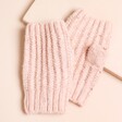 Soft Knitted Hand Warmers in Pink on a Beige Background