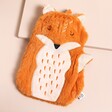 Finley Fox Hot Water Bottle on a Beige Background