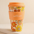 Sass & Belle 70s Floral Travel Coffee Cup on Beige Background