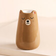 Sass & Belle Bear Vase Against Beige Backgrounf