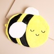 A smiling bumblebee hot water bottle