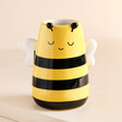 Sass & Belle Bee Vase Against Beige Background