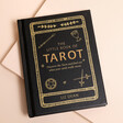 A black and gold pocket sized book offering tarot guidance on readings