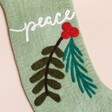 Close Up of Peace Stocking in Green