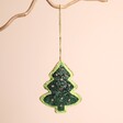 Christmas Tree Beaded Hanging Decoration on a beige background