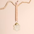 Mini Star Hanging Decoration on a beige background