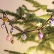 Mixed Mini Bauble Ribbon Garland on a festive Christmas tree with lights