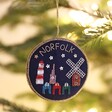 Norfolk Beaded Hanging Decoration on a tree adorned with fairy lights