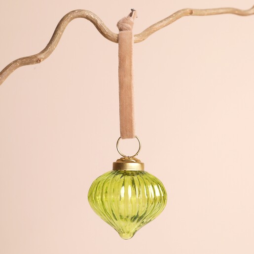 Ribbed Green Glass Sultan Bauble on a beige background