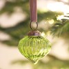 Ribbed Green Glass Sultan Bauble on a Christmas Tree adorned with fairy lights