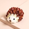 Pistachio Shells Hedgehog Standing Decoration on a Beige Background