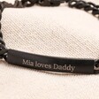 Close Up of Men's Black Stainless Steel Plaque Bracelet on neutral background