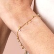 Close Up Model Shot for Dainty Flower Charm Bracelet in Gold