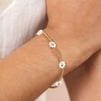 Model Shot of Stainless Steel White Daisy Beaded Bracelet in Gold