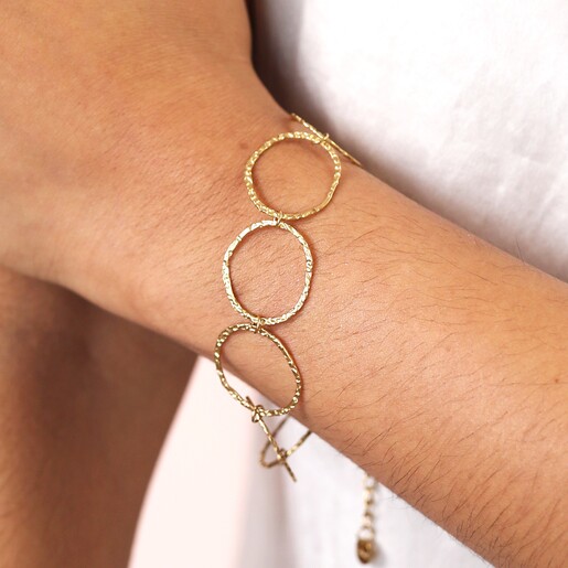 Close Up of Model Close Up of Stainless Steel Hoop Wrap Bracelet in Gold on Model