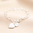 Personalised Name Heart Chain Bracelet in Silver on a Beige Background