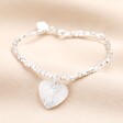 A beaded bracelet in silver with a textured heart charm pendant