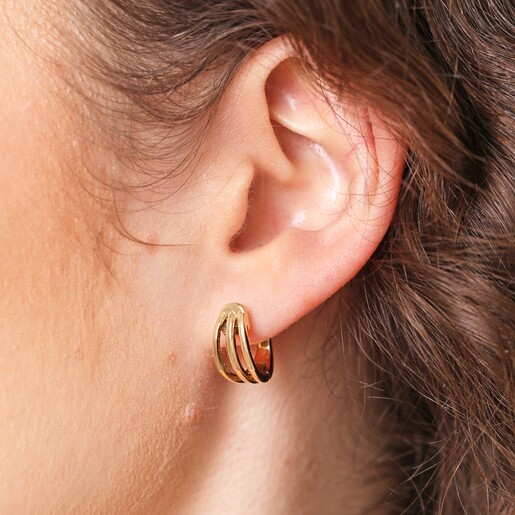 Close Up of Model Close Up of Stainless Steel Illusion Huggie Hoop Earrings in Gold on Model