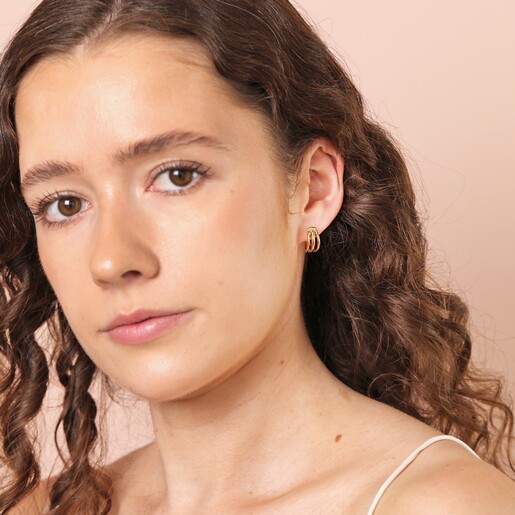 Model Shot Model Shot of Stainless Steel Illusion Huggie Hoop Earrings in Gold