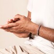 Close Up of Men's Stainless Steel Silver and Red Ball Chain Bracelet on Model