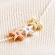 Personalised Mixed Metal Triple Star Bead Necklace on Beige Fabric