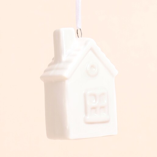 Close Up of the White Ceramic House Hanging Decoration