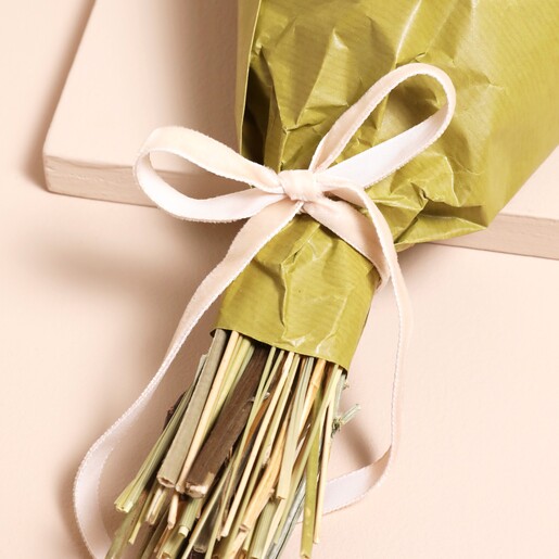 Pink velvet bow tied at the bottom on the bouqet