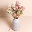 Fall Floral Dried Flower Bouquet in a vase against a beige backgroung