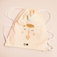 A Peach Pink Cotton Drawstring Bag with a Unicorn Face on a Neutral Background