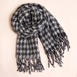 Charcoal Houndstooth Winter Scarf on a Beige Background