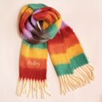 Personalised Rainbow Stripe Winter Scarf on a Beige Background