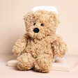 Warmies Junior Brown Curly Bear Microwavable Soft Toy on a neutral background