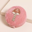 A Pink Velvet Foldable Compact Mirror With a Beaded Toadstool Design on The Lid