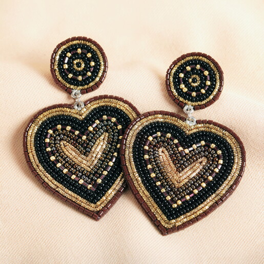 Black Beaded Heart Drop Earrings on a neutral background